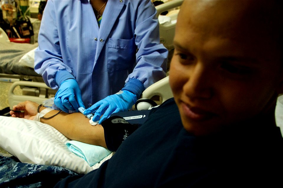 US Navy 110720-N-ZC343-853 Aviation Boatswain's Mate (Fuel) 3rd Class Tyler Keith, from Moline, Ill., has blood drawn during a blood drive aboard t