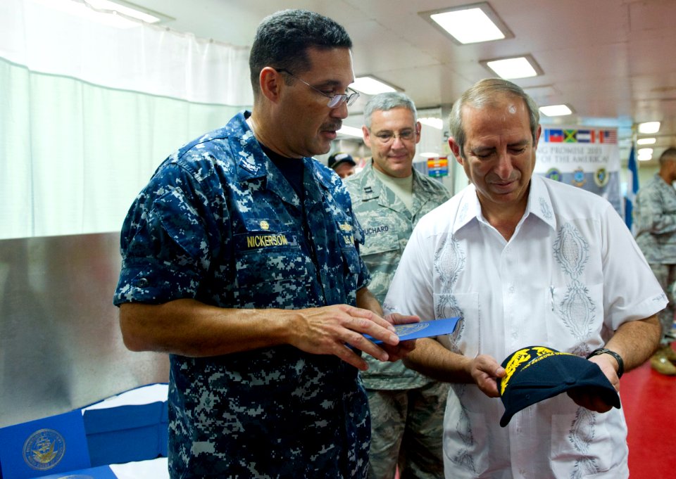 US Navy 110719-N-RM525-388 Commodore Brian Nickerson, mission commander of Continuing Promise 2011, gives Sigfrido Reyes, president of the Legislat