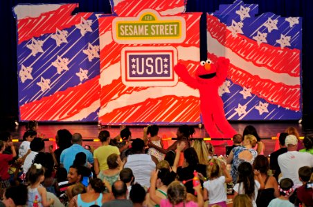 US Navy 110722-N-IZ292-006 Elmo greets the audience during a Sesame Street Live children's show at Naval Support Activity Naples during a USO and t photo