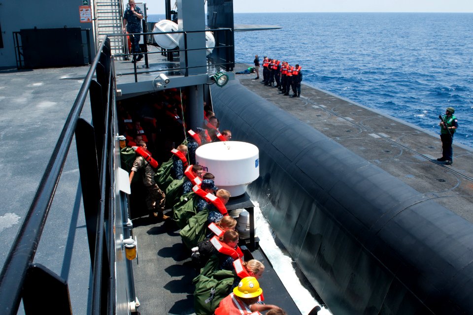 US Navy 110720-N-FG395-025 Navy ROTC midshipmen await transfer from the Military Sealift Command submarine and special warfare support vessel MV HO