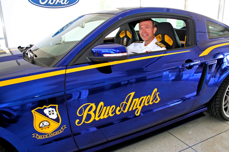 US Navy 110720-N-ZL585-274 Rear Adm. John E. Jolliffe, vice commander of U.S. Naval Forces Central Command, sits behind the wheel of the Navy Blue