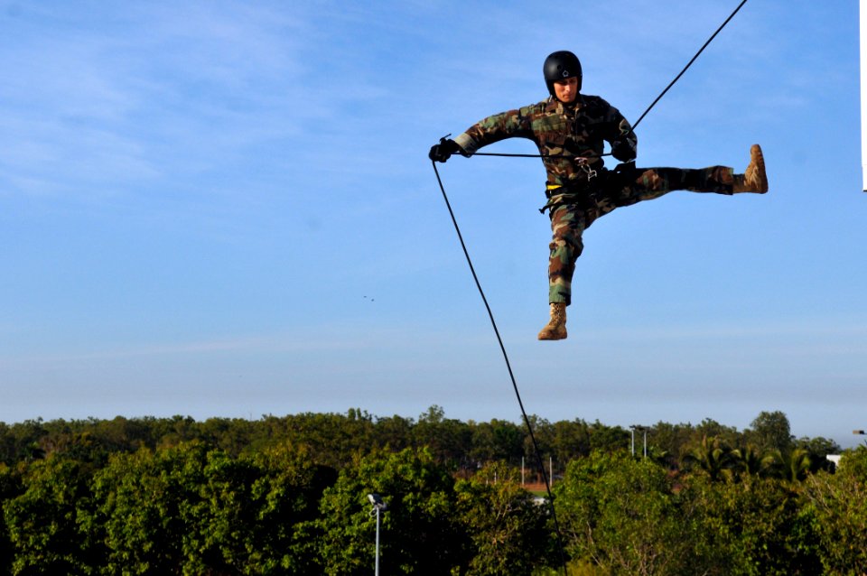 US Navy 110720-N-WW409-339 Lt. Ryan Ramsden, assigned to Explosive Ordnance Disposal Mobile Unit 5, rappels off a tower while training with members