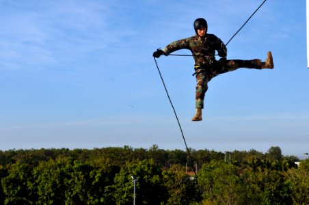 US Navy 110720-N-WW409-339 Lt. Ryan Ramsden, assigned to Explosive Ordnance Disposal Mobile Unit 5, rappels off a tower while training with members photo