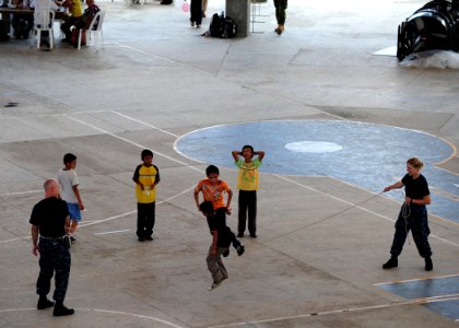 US Navy 110721-N-QD416-269 Sailors jump rope with Salvadoran children at the Polideportivo medical site in Acajutla, El Salvador, during Continuing