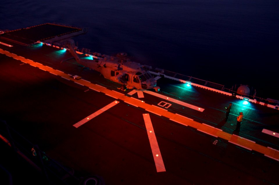 US Navy 110725-N-ZC343-320 Sailors perform pre-flight checks on the flight deck of USS Bonhomme Richard (LHD 6)