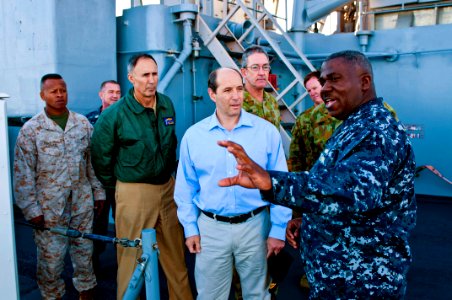 US Navy 110722-N-CZ945-112 Cmdr. Antonio D. Hull explains features of the ship's weapon system to U.S. Ambassador to Australia Jeffery L. Bleich