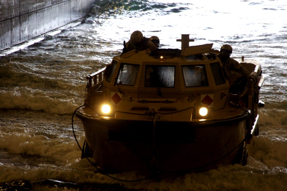 US Navy 110725-N-ZC343-173 A lighter amphibious re-supply cargo (LARC) vehicle enters the well deck of the amphibious assault ship USS Bonhomme Ric