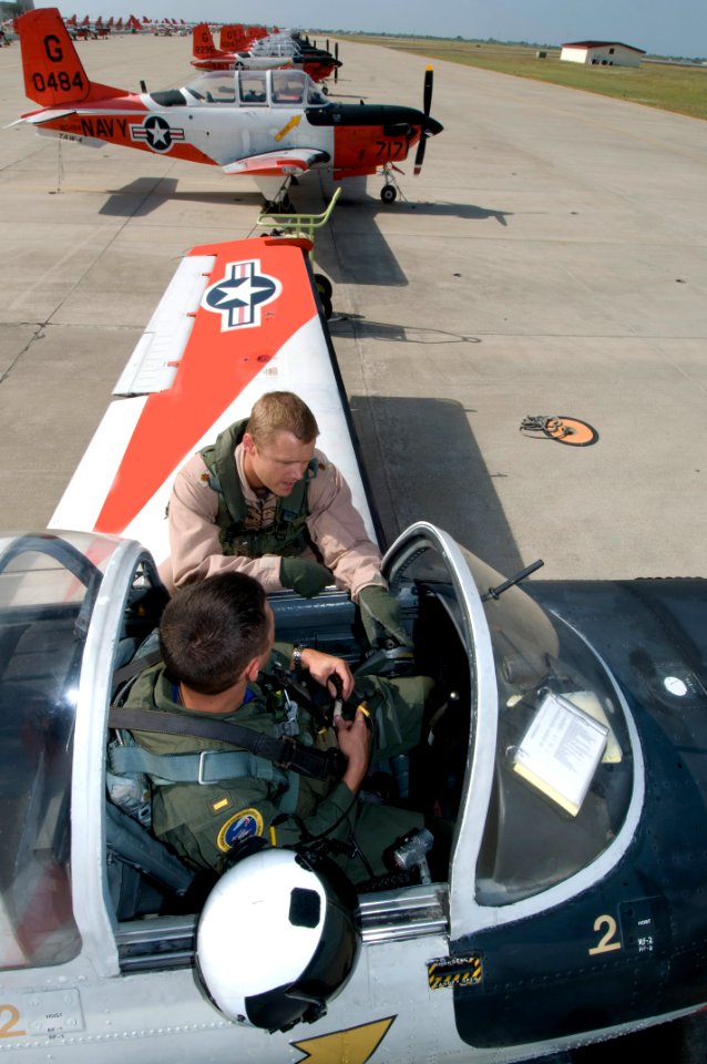 US Navy 110720-N-LY958-098 Instructor pilot Lt. Cmdr. Daniel Kelly and student naval aviator Ensign Christopher Tucker, both assigned to Training S