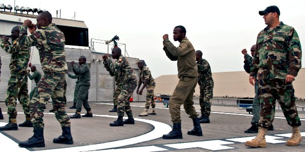 US Navy 110720-N-XK513-110 U.S. Navy instructors from Maritime Civil Affairs Security Training (MCAST) conduct self-defense training with members o photo