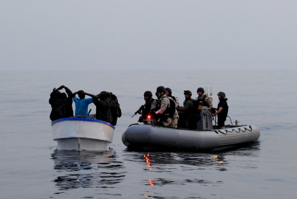 US Navy 110722-N-TY225-318 A visit, board, search and seizure team investigates a suspected pirate skiff