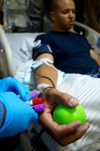 US Navy 110720-N-ZC343-852 Aviation Boatswain's Mate (Fuel) 3rd Class Tyler Keith, from Moline, Ill., has blood drawn during a blood drive aboard t