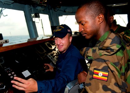 US Navy 110725-N-OV802-056 Boatswain's Mate Seaman Mitchel Zeleski instructs Tanzanian navy Capt. A.M. Kihula and Lance Cpl. S.K. Rutungu on the br