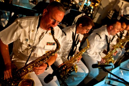 US Navy 110727-N-CZ945-088 Senior Chief Musician Joseph Rundall, left, Musician 3rd Class Amanda Ginn and Musician 3rd Class David Drescher play th