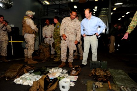 US Navy 110722-N-WA347-035 Hospital Corpsman Seaman Patrick Stokes explains to the U.S. Ambassador to Australia Jeffrey Bleich he type of gear he c