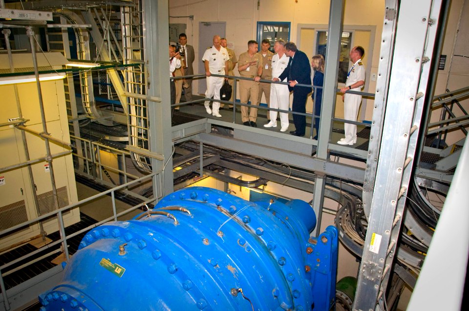 US Navy 110722-N-ZB612-129 Chief of Naval Operations (CNO) Adm. Gary Roughead, center, tours the facilities of Naval Surface Warfare Center, Carder