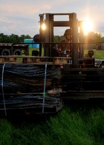 US Navy 110723-N-SD610-011 A Seabee assigned to (NMCB) 7 stages equipment for the battalion's move from its logistics supply area to their main bod