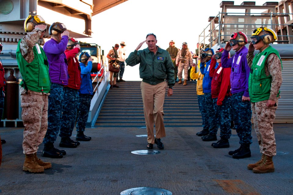 US Navy 110722-N-CZ945-004 Vice Adm. Scott Van Buskirk salutes rainbow sideboys upon his arrival aboard USS Germantown (LSD 42)