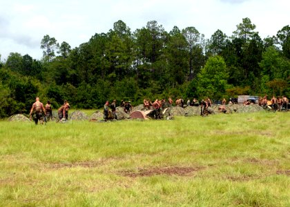 US Navy 110723-N-SD610-008 Seabees assigned to NMCB) 7 set up individual tent combat one person during Operation Bearing Duel