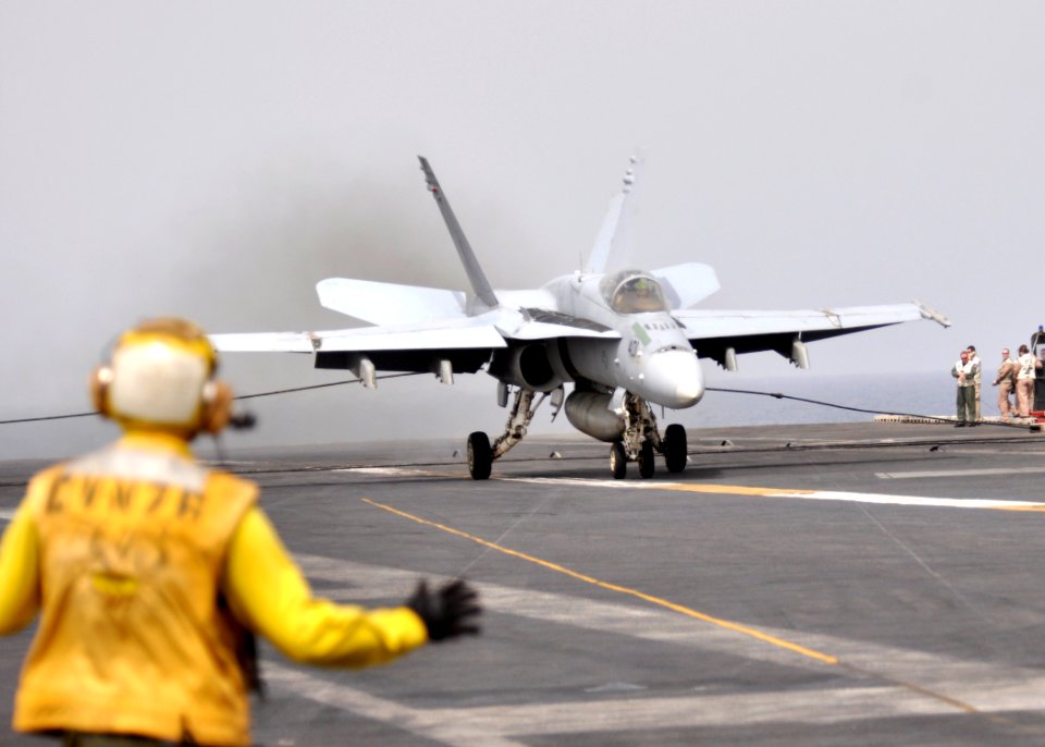 US Navy 110725-N-SG869-075 An F-A-18C Hornet makes an arrested landing aboard USS Ronald Reagan (CVN 76)