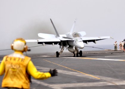 US Navy 110725-N-SG869-075 An F-A-18C Hornet makes an arrested landing aboard USS Ronald Reagan (CVN 76)