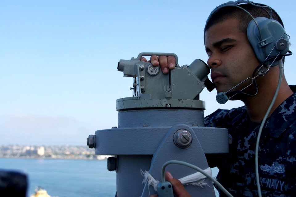 US Navy 110725-N-ZC343-052 Quartermaster Seaman Arwando Santamaria Diaz stands watch aboard USS Bonhomme Richard (LHD 6) as the ship transits the S