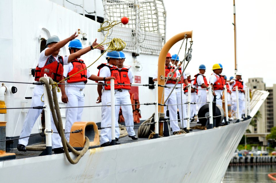 US Navy 110727-N-WP746-100 A sailor aboard the Philippine navy frigate BRP Gregorio del Pilar (PF-15) throws a line as the ship arrives at Joint Ba