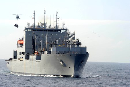 US Navy 110726-F-ET173-041 An MH-60S Sea Hawk helicopter transfers cargo from USNS Comfort (T-AH 20) to USNS Lewis and Clark (T-AKE 1)
