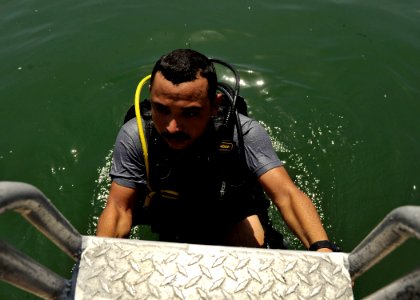 US Navy 110727-N-KB666-092 Joni Paniagua exits the water after conducting lift bag operations with Mobile Diving and Salvage Unit (MDSU) 2