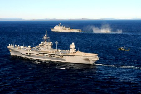 US Navy 110722-N-XG305-527 The U.S. 7th Fleet command ship USS Blue Ridge (LCC 19), front, conducts flight operations while underway with the amphi