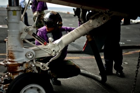 US Navy 110729-N-BT887-158 Aviation Boatswain's Mate (Fuel) Airman Michael Zaragoza refuels an EA-6B Prowler aboard USS John C. Stennis (CVN 74)