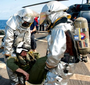 US Navy 110726-N-OV802-143 Sailors move a helicopter crash victim during a damage control drill aboard the guided-missile frigate USS Samuel B. Rob