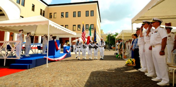 US Navy 110729-N-OM642-309 Guests, Sailors and civilian government employees render honors during the parading of the colors at the change of comma