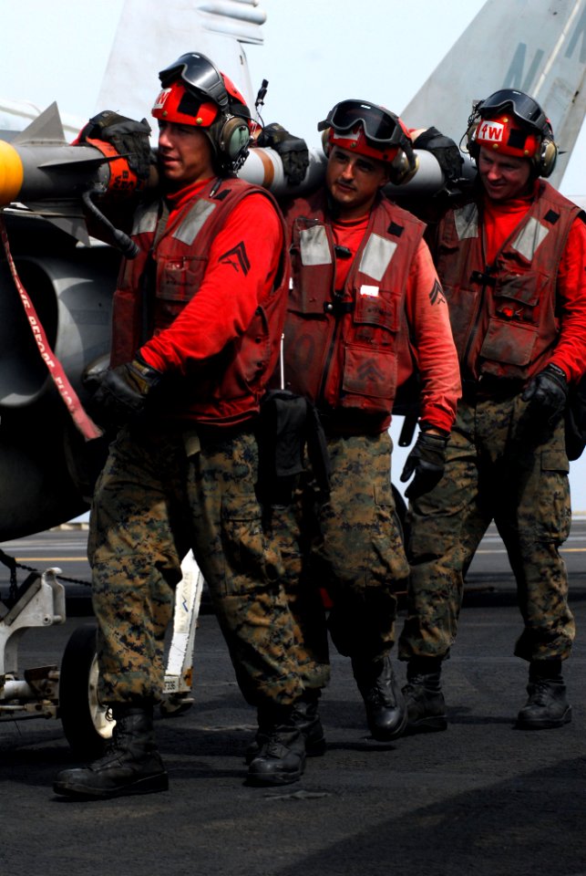 US Navy 110727-N-GL340-038 Marines move ordnance aboard USS Ronald Reagan (CVN 76)