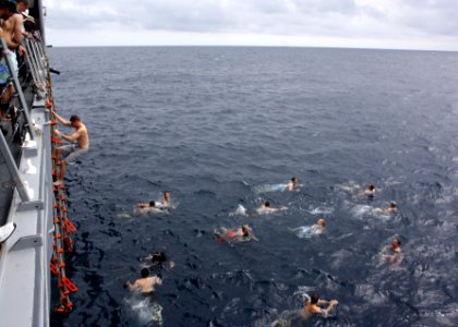 US Navy 110724-N-ZI300-013 Sailors aboard the guided-missile frigate USS Thach (FFG 43) participate in a swim call during the