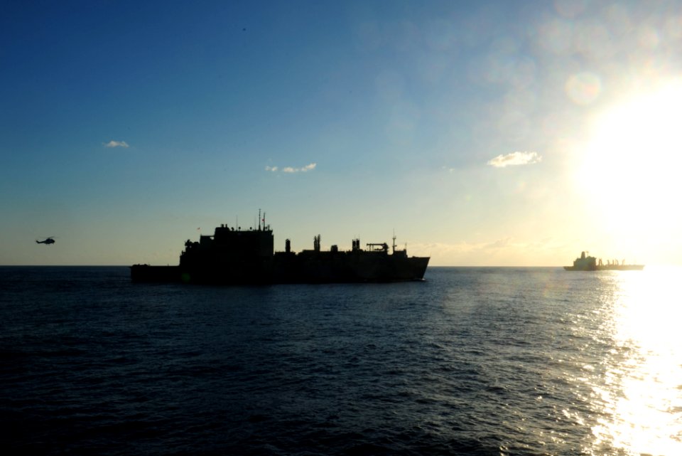 US Navy 110725-N-WA347-037 USNS Richard E. Byrd (T-AKE 4) and USNS John Ericsson (T-AO 194) transit near USS Germantown (LSD 42)