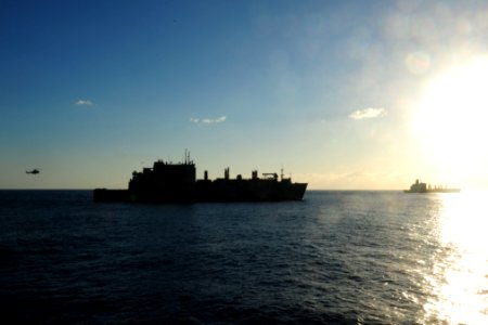US Navy 110725-N-WA347-037 USNS Richard E. Byrd (T-AKE 4) and USNS John Ericsson (T-AO 194) transit near USS Germantown (LSD 42)