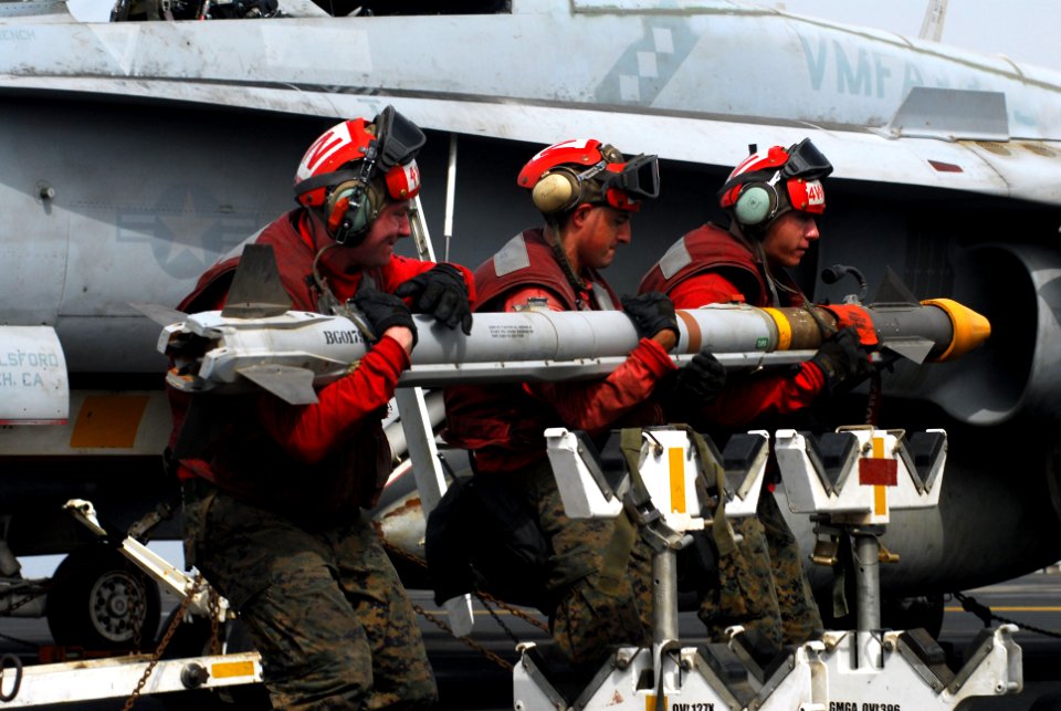 US Navy 110727-N-GL340-029 Marines move ordnance aboard USS Ronald Reagan (CVN 76)