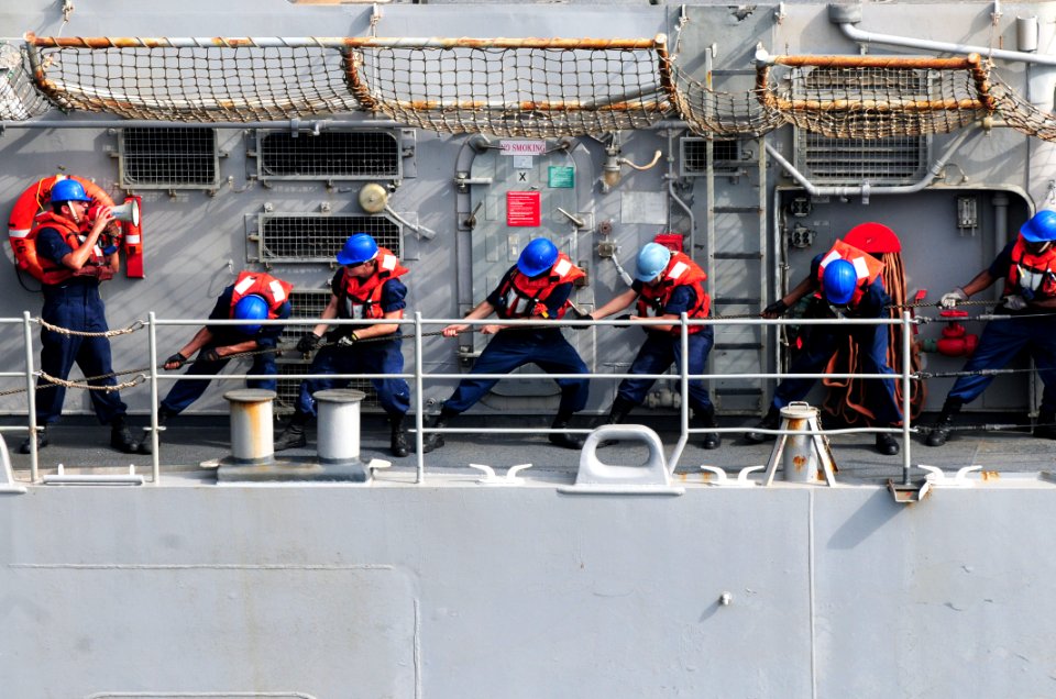 US Navy 110728-N-SB672-323 Sailors assigned to the guided-missile cruiser USS Chancellorsville (CG 62) heave lines to connect a fuel probe during a