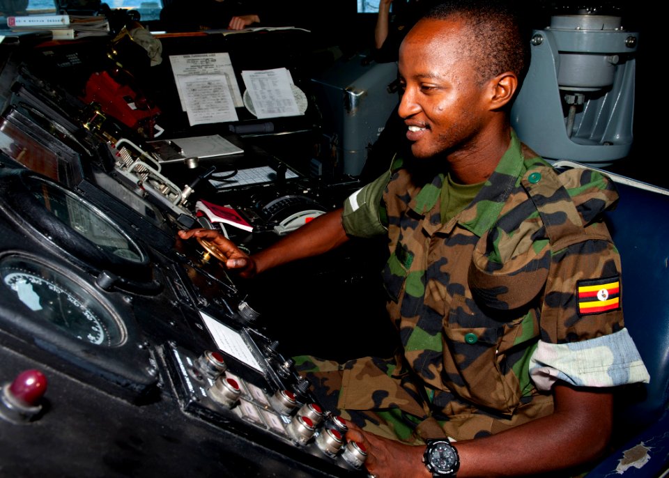 US Navy 110727-N-OV802-071 Tanzania navy Lance Cpl. S.K. Rutungu mans the helm aboard the guided-missile frigate USS Samuel B. Roberts (FFG 58) as