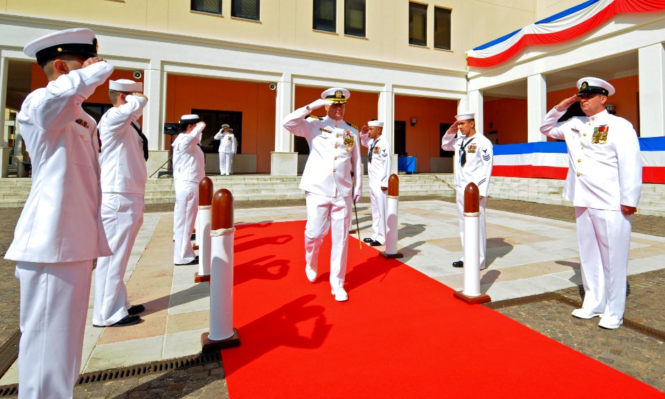 US Navy 110729-N-OM642-066 Capt. Richard Soucie receives honors as he arrives for the commander, Task Force (CTF) 63 change of command ceremony at