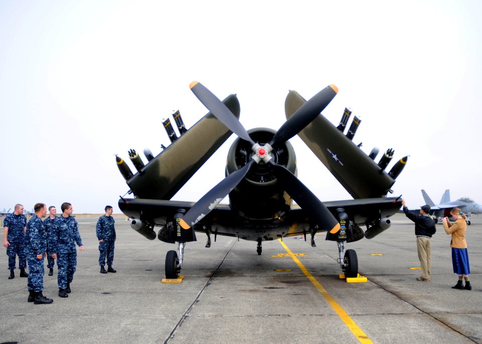 US Navy 110730-N-ZK021-002 Sailors looks at an A-1 Skyraider during the Centennial of Naval Aviation (CONA) celebration