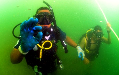 US Navy 110727-N-XD935-231 Jamaican Coast Guard Defense Force Diving Officer Lt. j.g. Christopher YeeSing gives the okay signal during his descent