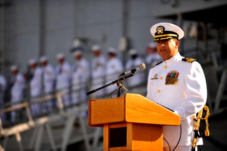 US Navy 110729-N-YR391-007 Cmdr. Rolando Ramirez delivers a speech during the decommissioning ceremony for USS Doyle (FFG 39)
