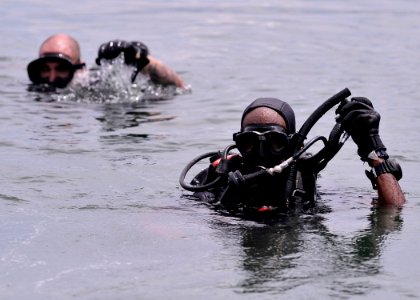 US Navy 110729-N-KB666-033 Lt. j.g. Peter Wilson-Kelly, right, and Leading Seaman C.G. Letourneaa prepare to leave the surface during joint diving