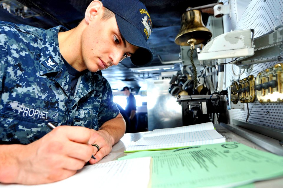 US Navy 110801-N-EE987-002 Boatswain's Mate 3rd Class Steven Prophet, from Boise, Idaho, mans the boatswain's mate of the watch on the bridge of th