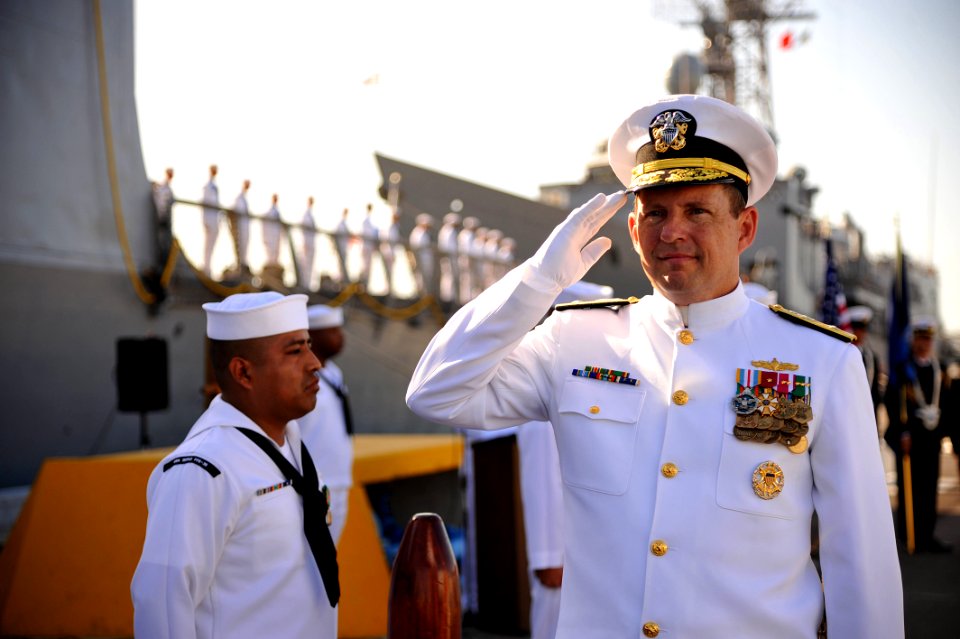 US Navy 110729-N-YR391-001 Rear Adm. Anthony Kurta salutes the sideboys during a decommissioning ceremony for USS Doyle (FFG 39)