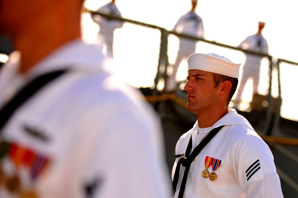US Navy 110729-N-YR391-004 Seaman Cody Monroe stands at parade rest during the decommissioning ceremony for USS Doyle (FFG 39)