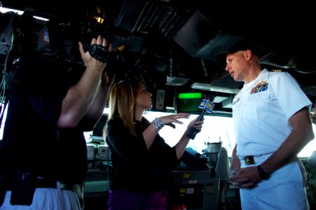 US Navy 110804-N-ZC343-951 NBC TV reporter Christie Johnson, from KING 5 in Seattle, interviews Capt. J.L. Harnden, commanding officer