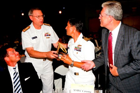 US Navy 110804-N-HW977-794 Vice Adm. Kevin McCoy, second from left, commander of Naval Sea Systems Command, shares the 2011 Engineer of the Year Ti photo