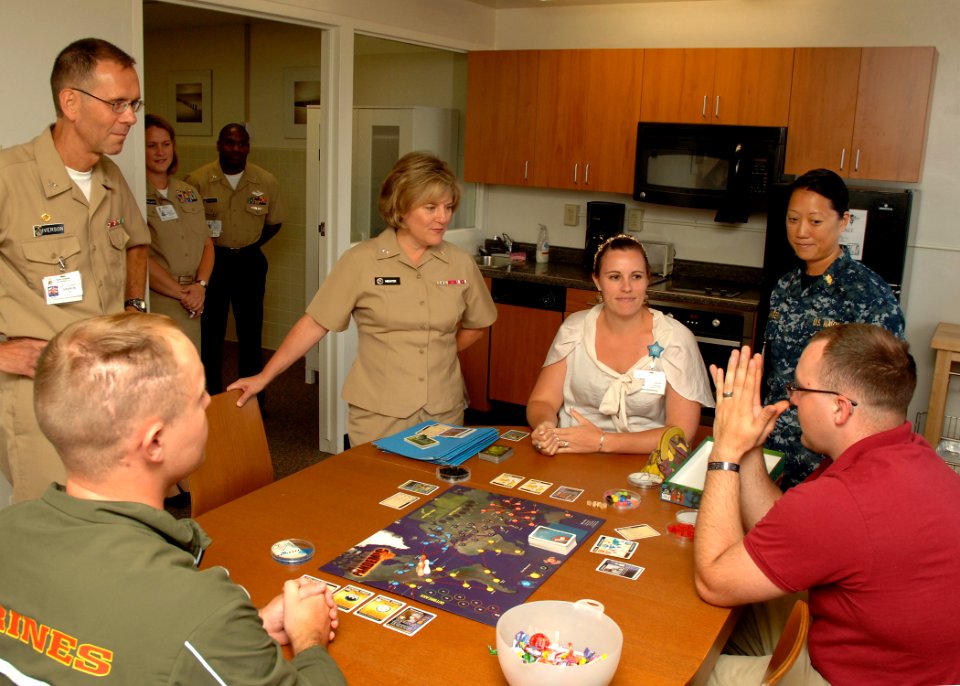 US Navy 110729-N-HJ915-082 Rear Adm. Elizabeth Niemyer, center, monitors a gaming group session in the Activities of Daily Living apartment at Nava